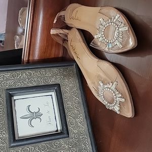 Myral light nude, pointed toe flats with Rhinestone accents.